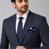 Blue Polka Drops pocket square — formal model · navy and tie.