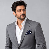 Blue Polka Drops pocket square — model · light grey and open collar.