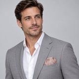 Blush Laurel Leaf Silk Pocket Square — model · light grey and open collar.