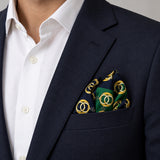 Chain Loop Green pocket square — navy jacket · alternate fold.