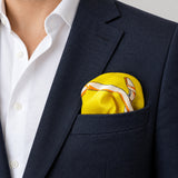 Chains and Straps (yellow) pocket square — navy jacket · wearing detail.