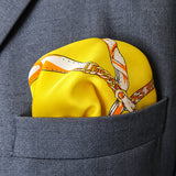 Chains and Straps (yellow) pocket square — close-up wearing detail.