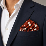 Copper Base Polka Dots pocket square — navy jacket · wearing detail.