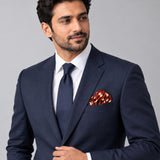 Copper Base Polka Dots pocket square — formal model · navy and tie.