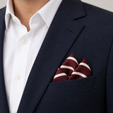Creamy Rosewood Stripes pocket square — navy jacket · alternate fold.