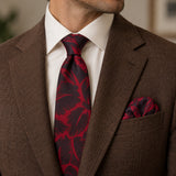 Crimson Leaf Silhouette silk tie and matching pocket square — Tobacco brown · notch lapel