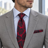 Crimson Leaf Silhouette silk tie and matching pocket square — Stone grey · pale blue shirt