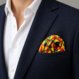 Geometric Art pocket square — navy jacket · wearing detail.
