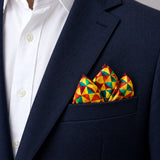 Geometric Art pocket square — navy jacket · alternate fold.