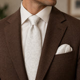 Ivory Scroll Damask silk tie and matching pocket square — Tobacco brown · notch lapel