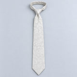 Ivory Scroll Damask Silk Tie — Relaxed knotted layout