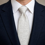 Ivory Scroll Damask Silk Tie — Knot and lapel close-up