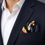 Mandarin Heron Black pocket square — navy jacket · wearing detail.