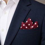 Maroon and White Polka Dots pocket square — navy jacket · alternate fold.