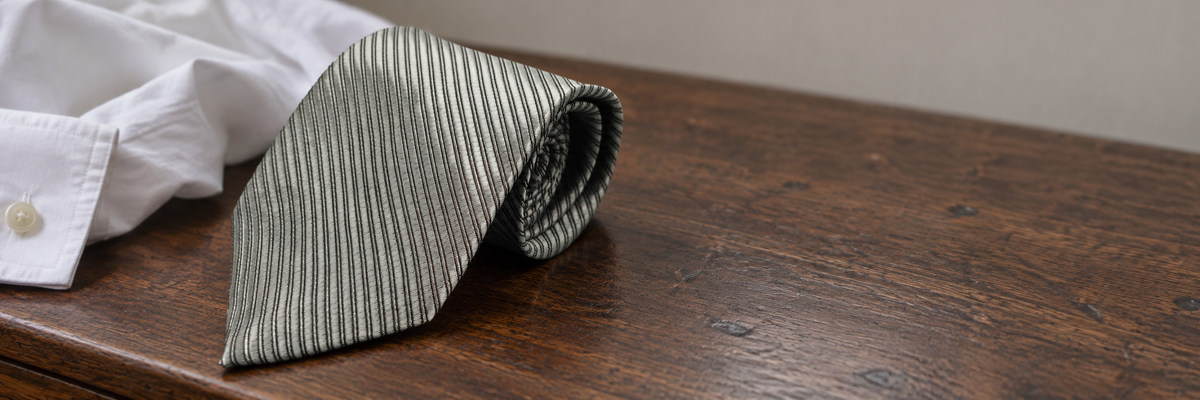 Striped Ties shown in a natural wearing context.