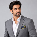 Navy and Gold Rugs pocket square — model · light grey and open collar.