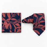 Navy Coral Laurel Leaf silk tie and matching pocket square — Natural coiled pair