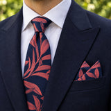 Navy Coral Laurel Leaf silk tie and matching pocket square — Navy peak lapel · pointed fold