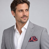 Navy Coral Laurel Leaf Silk Pocket Square — model · light grey and open collar.