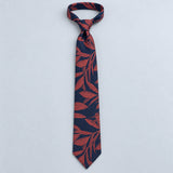 Navy Coral Laurel Leaf Silk Tie — Relaxed knotted layout