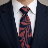 Navy Coral Laurel Leaf Silk Tie — Knot and lapel close-up