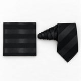 Noir Shadow Stripe silk tie and matching pocket square — Natural coiled pair