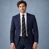 Noir Shadow Stripe Silk Tie — Navy suit portrait