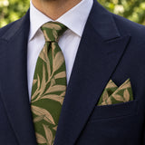 Olive Laurel Leaf silk tie and matching pocket square — Navy peak lapel · pointed fold