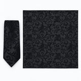Onyx Damask Scroll silk tie and matching pocket square — Full square · overhead pair