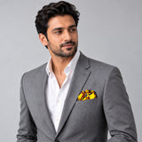 Paisley and Floral Mustard pocket square — model · light grey and open collar.