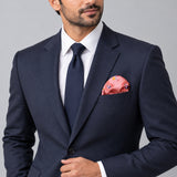 Pink Paisley Petals pocket square — formal model · navy and tie.