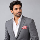 Pink Paisley Petals pocket square — model · light grey and open collar.