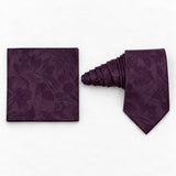 Plum Tropical Bloom silk tie and matching pocket square — Natural coiled pair