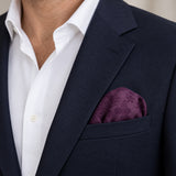 Plum Tropical Bloom Silk Pocket Square — navy jacket · rounded puff.