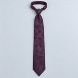 Plum Tropical Bloom Silk Tie — Relaxed knotted layout