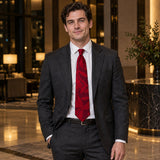 Scarlet Laurel Leaf Silk Tie — Charcoal suit evening