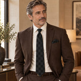 Shadow Checkerboard silk tie and matching pocket square — Deep brown · relaxed portrait