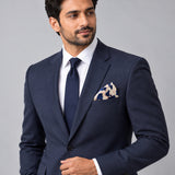 Snow Leopard pocket square — formal model · navy and tie.