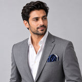 Starry Blue Night Polka Dots pocket square — model · light grey and open collar.