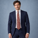 Terracotta Leaf Silhouette Silk Tie — Navy suit portrait