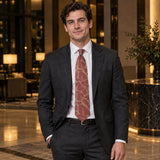 Terracotta Leaf Silhouette Silk Tie — Charcoal suit evening