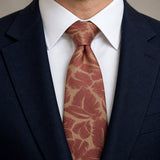 Terracotta Leaf Silhouette Silk Tie — Knot and lapel close-up