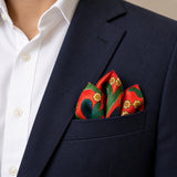The Fiery Garden pocket square — navy jacket · alternate fold.