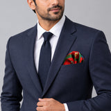 The Fiery Garden pocket square — formal model · navy and tie.