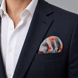 The Paisley Petals pocket square — navy jacket · wearing detail.