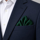 Deep Green pocket square — navy jacket · alternate fold.