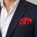 Twinkle Maroon pocket square — navy jacket · wearing detail.
