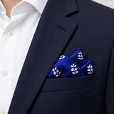 White Conifer pocket square — navy jacket · alternate fold.